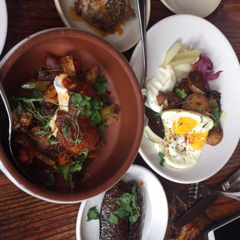 Terra Plata - roast pork hash on the left and morcilla sausage dish on the right; meat on the side since my friend is vegetarian and I'm not! - New American Near Me - Seattle, Washington Terra Plata - roast pork hash on the left and morcilla sausage dish on the right; meat on the side since my friend is vegetarian and I'm not! - New American Near Me - Seattle, Washington