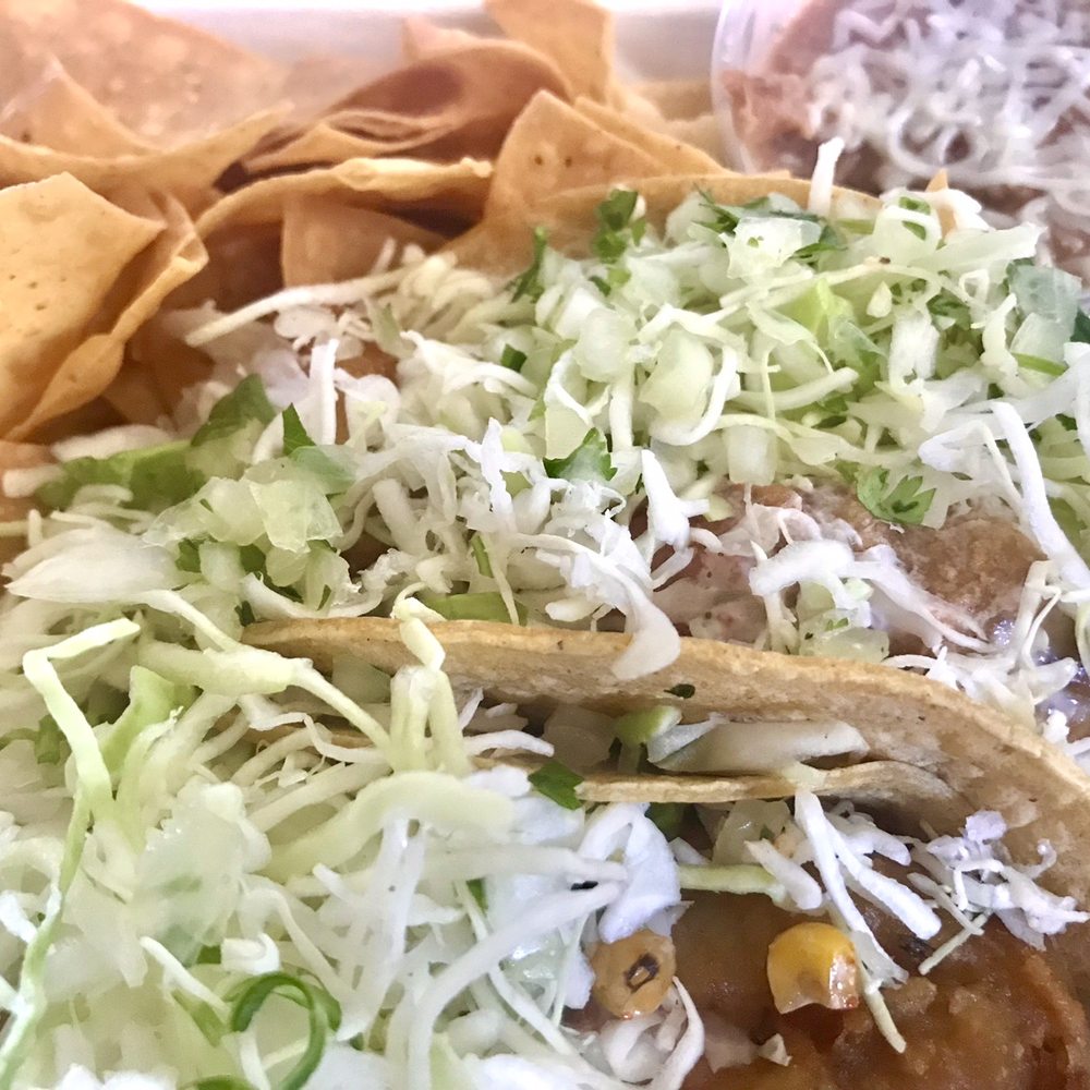 Fish Taco Especial Two Taco Plate with "no fried" pinto beans and tortilla chips. Perfection. Fish Taco Especial Two Taco Plate with "no fried" pinto beans and tortilla chips. Perfection.