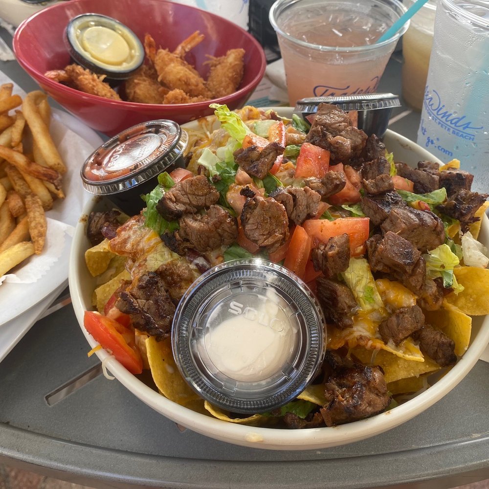 Salty's Beach Lounge - Steak nachos , fries and coconut shrimp . Everything but the fries were delicious !! - Lounges Near Me - St Pete Beach, Florida Salty's Beach Lounge - Steak nachos , fries and coconut shrimp . Everything but the fries were delicious !! - Lounges Near Me - St Pete Beach, Florida