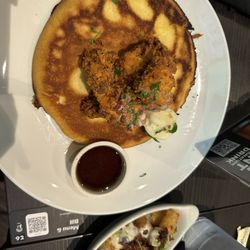 Tom's Watch Bar - Minneapolis - Chicken and Cornbread Pancake with a side of Loaded Tater Tots for $3 extra.