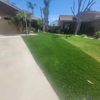 JC & Sons Landscaping - New sod and sprinklers in the front yard - Landscaping Near Me