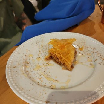 Agapi Bistro + Garden - Baklava with a rose simple syrup - Mediterranean Near Me - Pensacola, Florida Agapi Bistro + Garden - Baklava with a rose simple syrup - Mediterranean Near Me - Pensacola, Florida