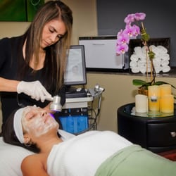 AgeFocus - Our Aesthetician performing a facial