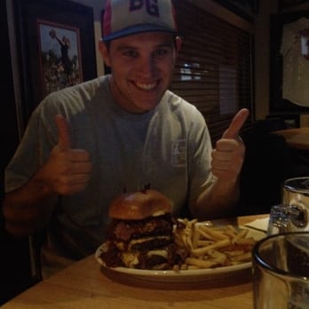 The Dugout - My buddy Ryan versus the Shermanator (3 patties, fried eggs, pastrami, chili, and 3 pieces of cheese). - Sports Bars Near Me - Simi Valley, California The Dugout - My buddy Ryan versus the Shermanator (3 patties, fried eggs, pastrami, chili, and 3 pieces of cheese). - Sports Bars Near Me - Simi Valley, California