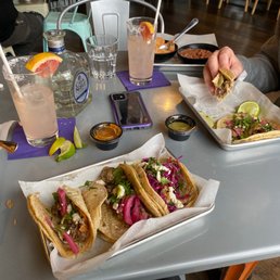 Carnitas tacos, blackened fish tacos, beans and rice. Carnitas tacos, blackened fish tacos, beans and rice.