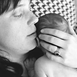 Portrait of a mamma and her newborn baby.