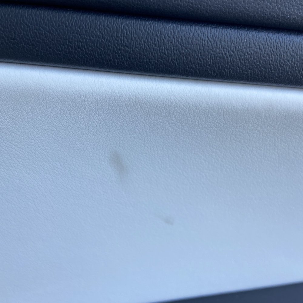Greasy residue on driver side interior
