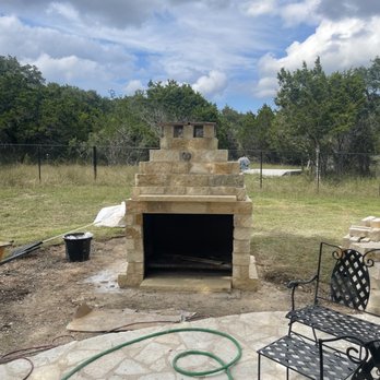 Passiflora Landscapes - a patio with a fire place - Landscaping Near Me - New Braunfels, Texas