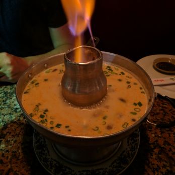 Thai Cafe - Tom Ka Gai. Filled with chicken and mushrooms. On the creamier side rather than sour. If you like that, you'll love this. Yes it's on fire. - Thai Near Me - Miami Lakes, Florida