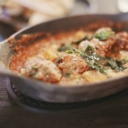 Hell's Kitchen - Wagyu Meatballs. Wagyu & pork meatballs in tomato sauce with polenta croutons, parmesan cheese, and topped with basil.