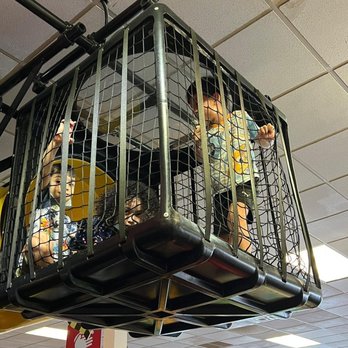 Chuck E. Cheese - a man in a cage - Pizza Near Me - Bayamon, Puerto Rico