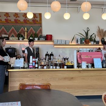 Broadcast Coffee - a woman standing at a counter in a coffee shop - Coffee & Tea Near Me - Boise, Idaho Broadcast Coffee - a woman standing at a counter in a coffee shop - Coffee & Tea Near Me - Boise, Idaho