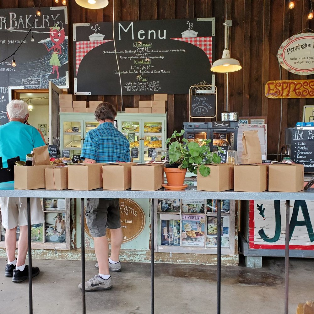 Pennington Farms - a couple of people at a food stand - Bakeries Near Me - Grants Pass, Oregon Pennington Farms - a couple of people at a food stand - Bakeries Near Me - Grants Pass, Oregon