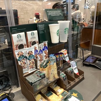 Starbucks - a display of coffee and snacks - Coffee & Tea Near Me - Fayetteville, North Carolina Starbucks - a display of coffee and snacks - Coffee & Tea Near Me - Fayetteville, North Carolina