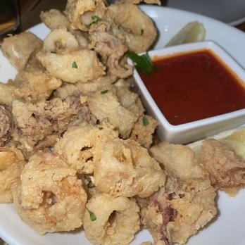 Rubirosa - Fried calamari with spicy marinara - Italian Near Me - New York, New York Rubirosa - Fried calamari with spicy marinara - Italian Near Me - New York, New York
