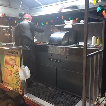 El Perron de Obregon - a man preparing food - Hot Dogs Near Me - Tucson, Arizona