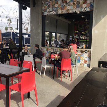 The Yard - people sitting at tables outside of a restaurant - Food Trucks Near Me - McAllen, Texas The Yard - people sitting at tables outside of a restaurant - Food Trucks Near Me - McAllen, Texas