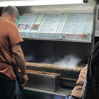 Fat Ni BBQ Cart - a man cooking food - Barbeque Near Me - Flushing, New York Fat Ni BBQ Cart - a man cooking food - Barbeque Near Me - Flushing, New York