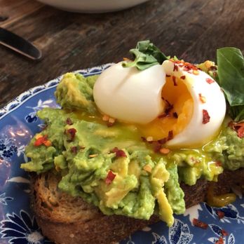 The Allis - Avocado toast and kale salad with salmon - Lounges Near Me - Chicago, Illinois The Allis - Avocado toast and kale salad with salmon - Lounges Near Me - Chicago, Illinois