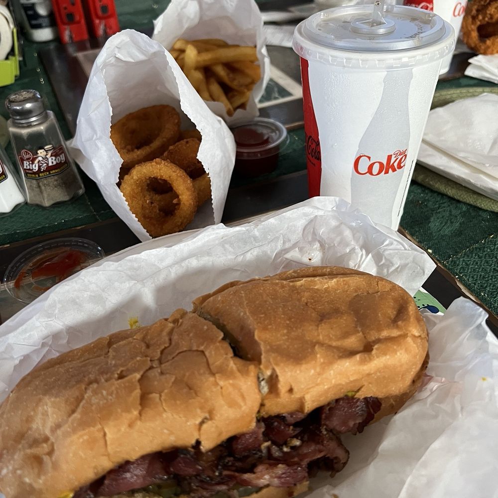 Garlands Hamburgers - Pastrami sandwich with onion rings and fries. - Burgers Near Me - Grover Beach, California Garlands Hamburgers - Pastrami sandwich with onion rings and fries. - Burgers Near Me - Grover Beach, California