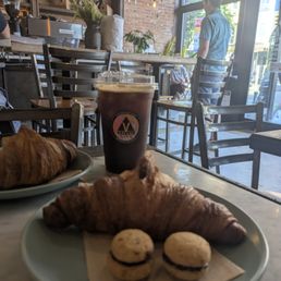 Croissant, indoors, americano Croissant, indoors, americano