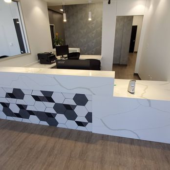 JG Natural Stone - Custom Quartz reception desk with mitered edges and a waterfall transition. Precision-crafted for a seamless, high-end commercial look - Countertop Installation Near Me - Fort Worth, Texas JG Natural Stone - Custom Quartz reception desk with mitered edges and a waterfall transition. Precision-crafted for a seamless, high-end commercial look - Countertop Installation Near Me - Fort Worth, Texas