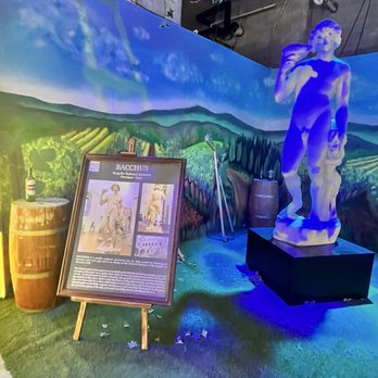 Michel Angelo Art and Legacy - the "Bacchus" sculpture, which depicts the Roman god of wine in a drunken state. - Art Galleries Near Me - Miami Beach, Florida