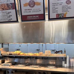 The Chicken Place - Food menu and cooking area.