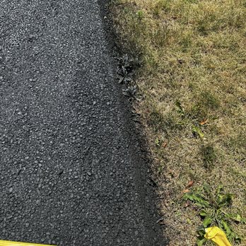 Eli’s Paving - Black seal coat sprayed on the grass - Masonry/Concrete Near Me - Columbus, Ohio Eli’s Paving - Black seal coat sprayed on the grass - Masonry/Concrete Near Me - Columbus, Ohio