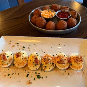 Chef Art Smith's Reunion - Appetizer's devil eggs and hush puppies - American Near Me - Chicago, Illinois