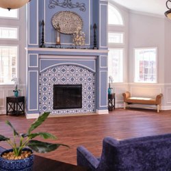Chapters Living of Tulsa - The community area the comfortable and inviting, with a fire place at the center.