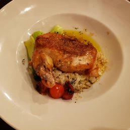 Roasted chicken over risotto and bok choy. Roasted chicken over risotto and bok choy.