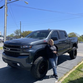 Road Runner Wheels - My wife next to my truck that had a lift, tires and rims done here at roadrunner wheels and tires - Tires Near Me - Marietta, Georgia Road Runner Wheels - My wife next to my truck that had a lift, tires and rims done here at roadrunner wheels and tires - Tires Near Me - Marietta, Georgia