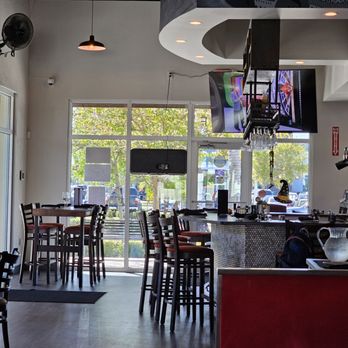 Osteria Bricco - a view of a restaurant with tables and chairs - Italian Near Me - Seminole, Florida Osteria Bricco - a view of a restaurant with tables and chairs - Italian Near Me - Seminole, Florida