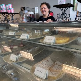 The owner with her own in house made desserts and cheesecakes.