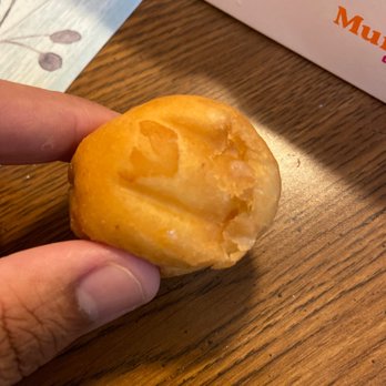 Dunkin' - a hand holding a donut with a bite taken out of it - Donuts Near Me - Roanoke, Virginia Dunkin' - a hand holding a donut with a bite taken out of it - Donuts Near Me - Roanoke, Virginia