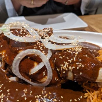 Nopalito - Mole Poblanoon Poved - Braised half chicken, dry chiles, spices, plantains, ts, hoolate, sesame seeds, onions - Mexican Near Me - San Francisco, California Nopalito - Mole Poblanoon Poved - Braised half chicken, dry chiles, spices, plantains, ts, hoolate, sesame seeds, onions - Mexican Near Me - San Francisco, California