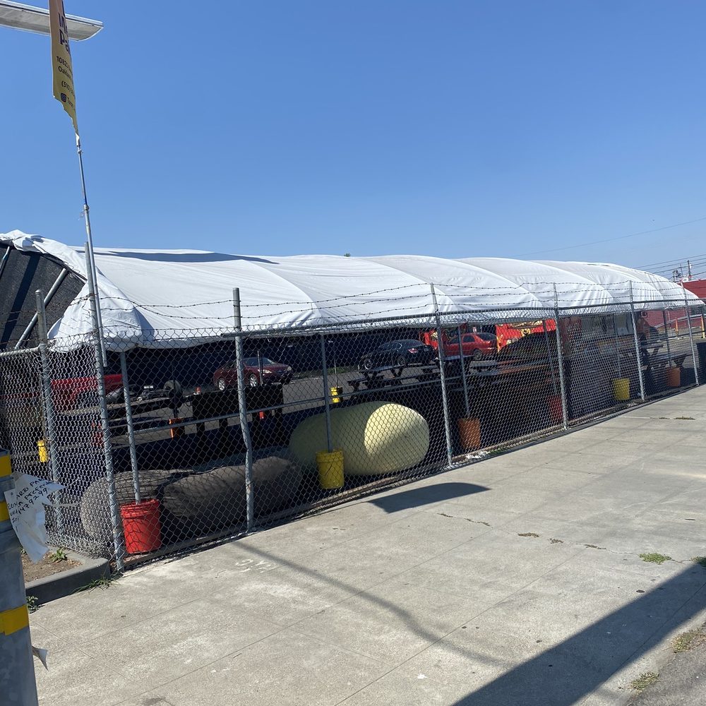 Tented dining area seen from street.