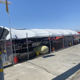 Tented dining area seen from street. Tented dining area seen from street.
