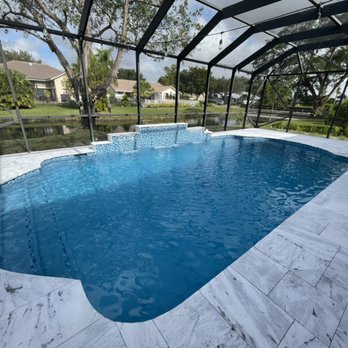 Pyramid Pool Services - Lucida sandblasted marble deck, 3 water falls, Hawaiian blue - Pool & Hot Tub Service Near Me - Coral Springs , Florida Pyramid Pool Services - Lucida sandblasted marble deck, 3 water falls, Hawaiian blue - Pool & Hot Tub Service Near Me - Coral Springs , Florida