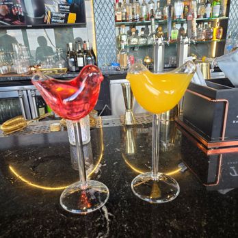Perch Rooftop - Themed signature drinks. Flickercrest (R) and Sky Drifter (L) - American Near Me - Omaha, Nebraska Perch Rooftop - Themed signature drinks. Flickercrest (R) and Sky Drifter (L) - American Near Me - Omaha, Nebraska