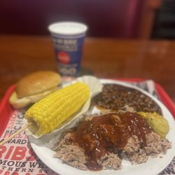Full Moon BBQ - BBQ Pork Plate with Corn on the Cob and Baked Beans and a bun and a water