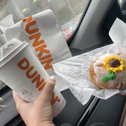 Custom decorated doughnut, and a coffee