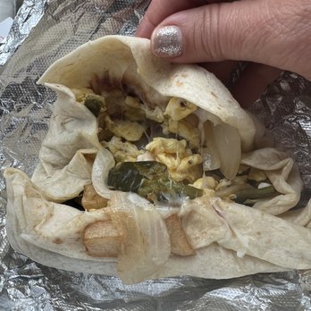 CC’s Tortas - a hand holding a tortilla - Mexican Near Me - Fredericksburg, Texas