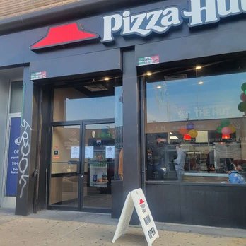 Pizza Hut - a sign in front of a pizza hut - Pizza Near Me - Queens, New York