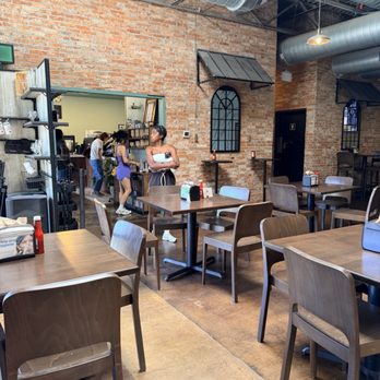 Maple Branch Craft Brewery - Tables and entrance to coffee shop - Breweries Near Me - Fort Worth, Texas Maple Branch Craft Brewery - Tables and entrance to coffee shop - Breweries Near Me - Fort Worth, Texas