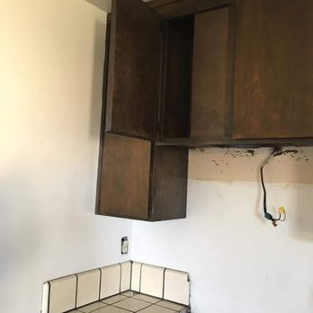 JC Building Maintenance - Before picture of our kitchen cabinets - Handyman Near Me