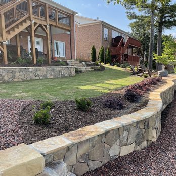 Whitwell Landscaping - Lakeside retaining wall with rock stairs, lawn, and upper retaining wall. - Landscaping Near Me Whitwell Landscaping - Lakeside retaining wall with rock stairs, lawn, and upper retaining wall. - Landscaping Near Me