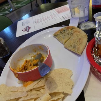 99 Hops House - What's left of the Buffalo chicken dip...yes that plate was full. - Sports Bars Near Me - Joliet, Illinois