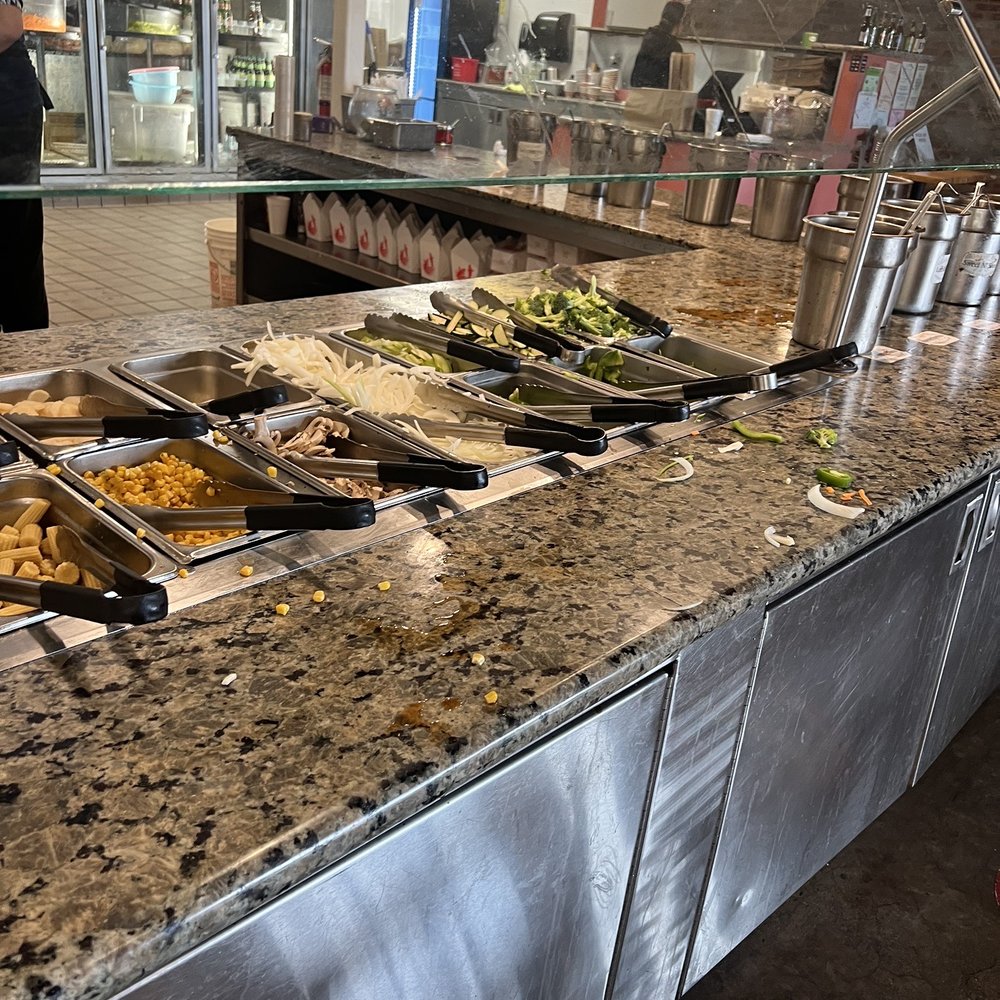 a buffet with a variety of food items a buffet with a variety of food items